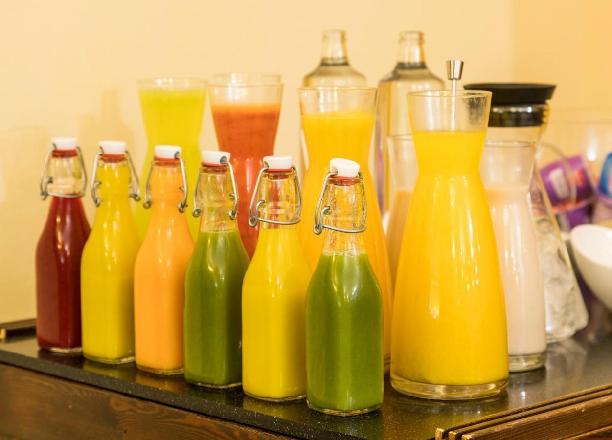 Hotel Ilunion Merida Palace Exterior photo Bottles of fruit juice